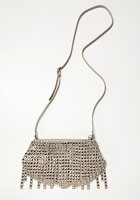 Nietenbag with fringe on white background