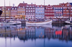 View of bars and restaurants in Nyhavn harbour in Copenhagen, Denmark