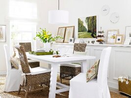 Wicker furniture with slipcovers, image gallery and table in dining room