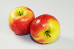 Close-up of two apples on white background