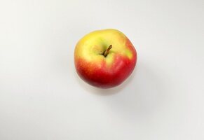 Close-up of gala apple on white background