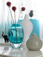Blue, white and mud coloured vase on table
