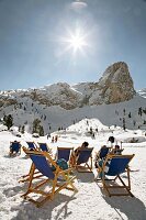 People relaxing in Rifugio Scotoni at Conturines mountain, Alta Badia, South Tyrol, Italy