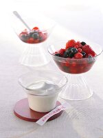 Red fruit jelly with vanilla foam in glass bowl