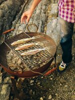 Fish being grilled outdoors