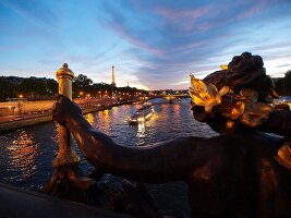 Pont Alexandre III over Seine river in night lights in Paris, France