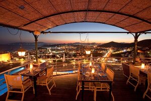 View of restaurant Tuti in Mamara hotel with cityscape at night in Istanbul, Turkey