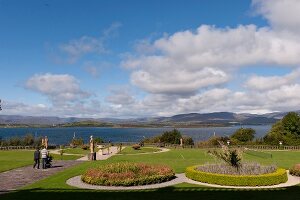 View of front garden in Bantry House with sea in background, Ireland, UK