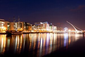 View of illuminated Samuel Becket Bridge at night, Dublin, Ireland, UK