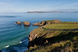 View of path passing through Antrim coast to Carrick-a-Rede Rope Bridge, Ireland, UK