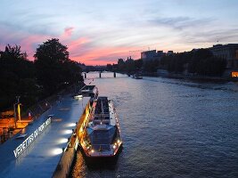 Ferry moored beside Pont Neuf in Seine river, Paris, France