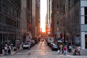 People at Fifth Avenue at 42nd Street at sunset, New York, USA
