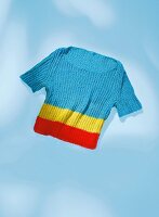 Cropped sweater on blue background