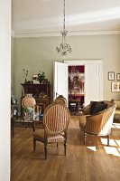 Interior of room with chairs, table and chandelier