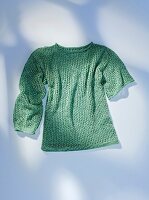 Green sweater on white background
