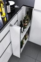 Elevated view of bottles in cabinet drawer