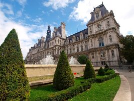 Topiary and fountain in front of Hotel de Ville in Paris, France