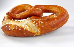 Pretzel cut at edge on white background