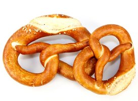 Two pretzels on white background