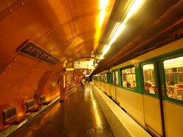 Senior woman waiting at Arts et Metiers metro station in Paris, France