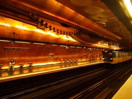 Senior woman waiting at Arts et Metiers metro station in Paris, France