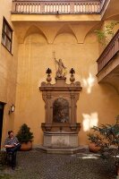 Wall fountain in Eserhauses in Maximilian Street, Augsburg, Bavaria, Germany