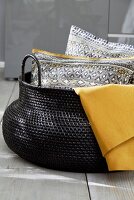 Scatter cushions in large basket