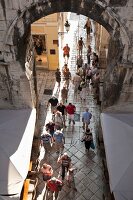 Tourists at iron gate in Split, Croatia