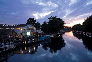 View of  Stamford Hill, Floating Cinema and river Lee in East End at dusk, London, UK