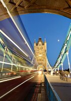 Light trails of speedy vehicles on Tower Bridge, Southwark, London, England, blurred