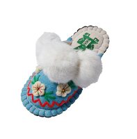 Close-up of felt slippers with flowers on white background