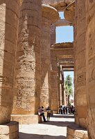 People standing at the Great Hypostyle Hall of Temple Karnak near Luxor, Egypt