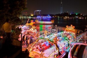 View of people in illuminated boat on Nile river, Cairo, Egypt