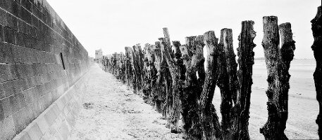 Wall and wooden post at the beach in Brittany, France