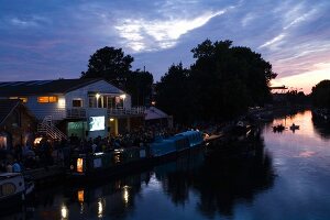 View of  Stamford Hill, Floating Cinema and river Lee in East End at dusk, London, UK