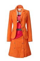 Orange blazer and skirt with pink top, belt and necklace