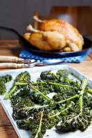 Poularde in pan with baked kale on baking tray