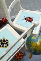 Chair seats decorated with beetle decoupage