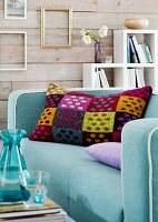 Colourful tweed scatter cushion on sofa in living room