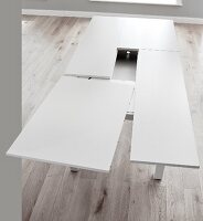 Resizing white dining table made of wood