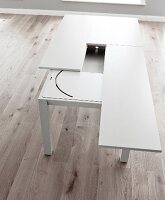 Resizing white dining table made of wood