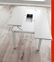 Resizing white dining table made of wood