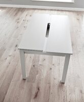 Resizing white dining table made of wood