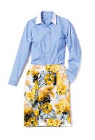 Blue striped shirt with floral pattern skirt on white background