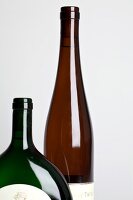 Close-up of wine bottles against white background