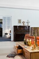 Living room with low sideboard and piano