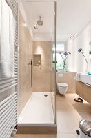 Bathroom with beige cubicle shower