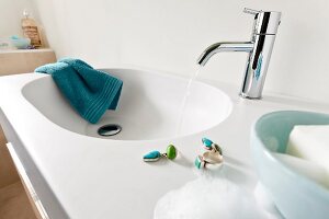 Running water from vanity sink in bathroom