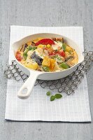 Eggplant with egg and potatoes in sauce pan