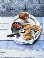 Crispy fried fish with tomato salsa and rosemary potatoes
